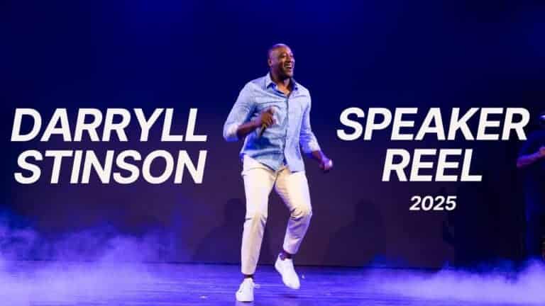 High-energy image of Keynote Speaker Darryll Stinson jumping on stage in front of a screen displaying "Darryll Stinson Speaker Reel 2025" with stage fog effects.